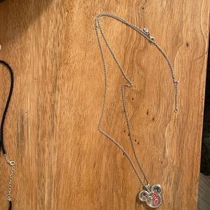 Pandora Mickey pendant necklace with 5 Mickey charms inside pendant